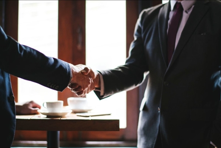 Two businessman shaking hands