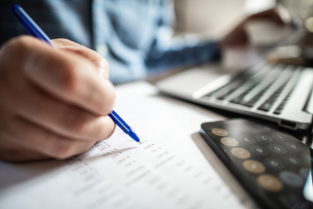 Man with financial documents indoors